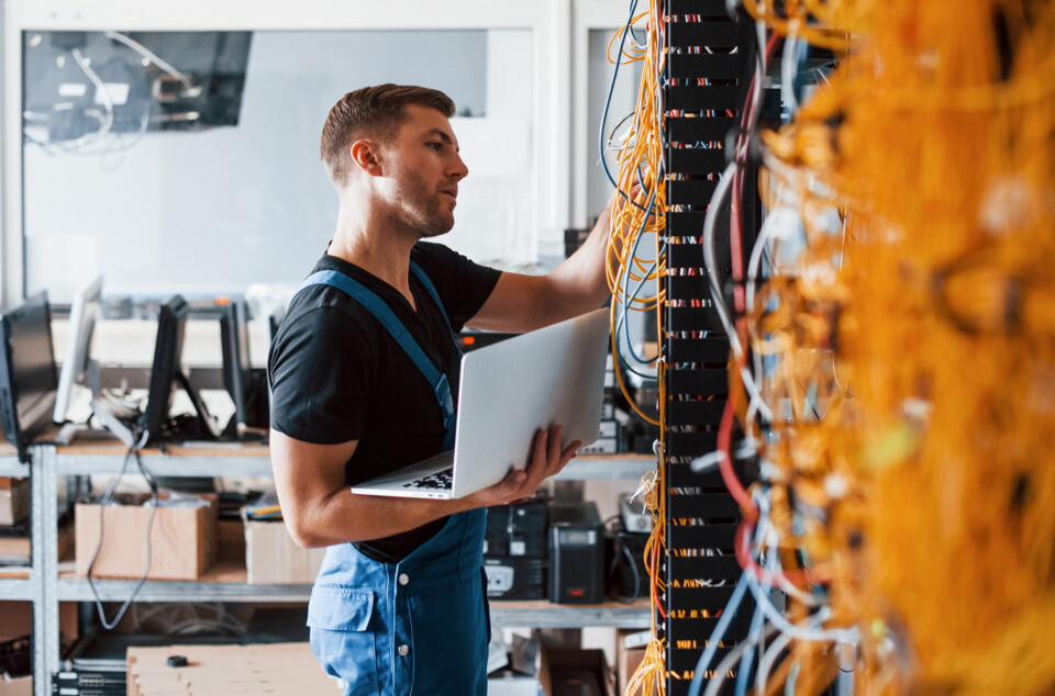 Server service server rack cabling young engineer male cables support service
