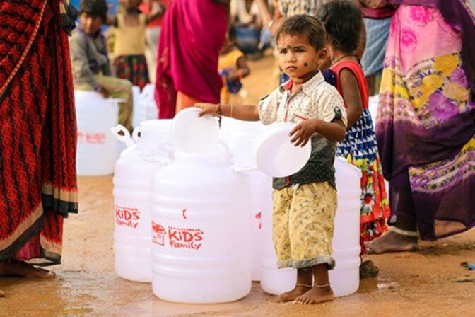cute little girl slum india bangalore water distribution